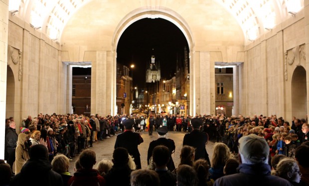 Members of the public gather at the Menin Gate as Buglers from Ypres Fire Service  play the last post during the daily act of remembrance at the Menin Gate Memorial, Ypres, Belgium.